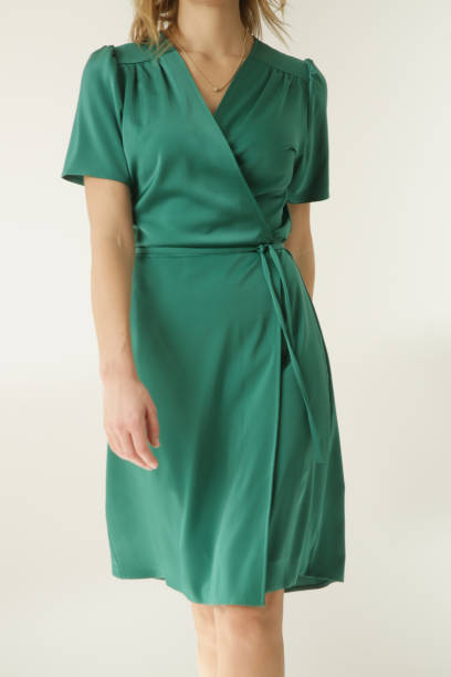 Green wrap dress reflecting the craft of luxury at Style Haven, designed with minimalist elegance and refined structure."